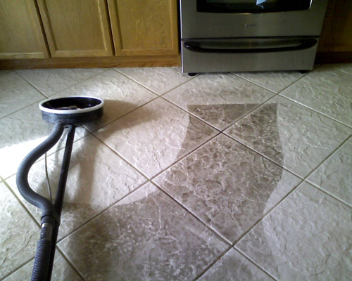 Tile floor being cleaned.